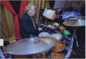 Jim ‘The Rocket’ Durkin playing drums with Memories Music